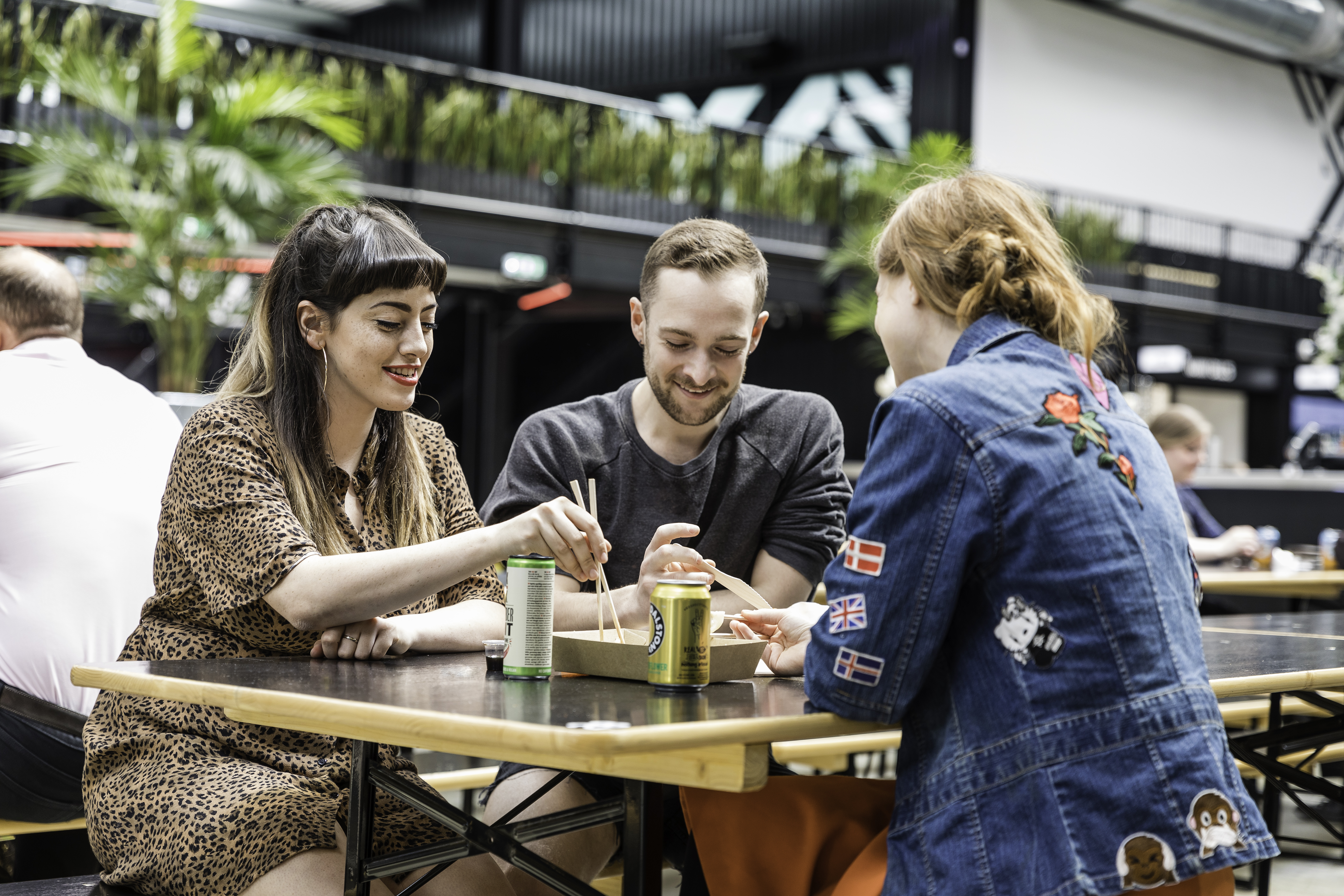 three people enjoying lunch together