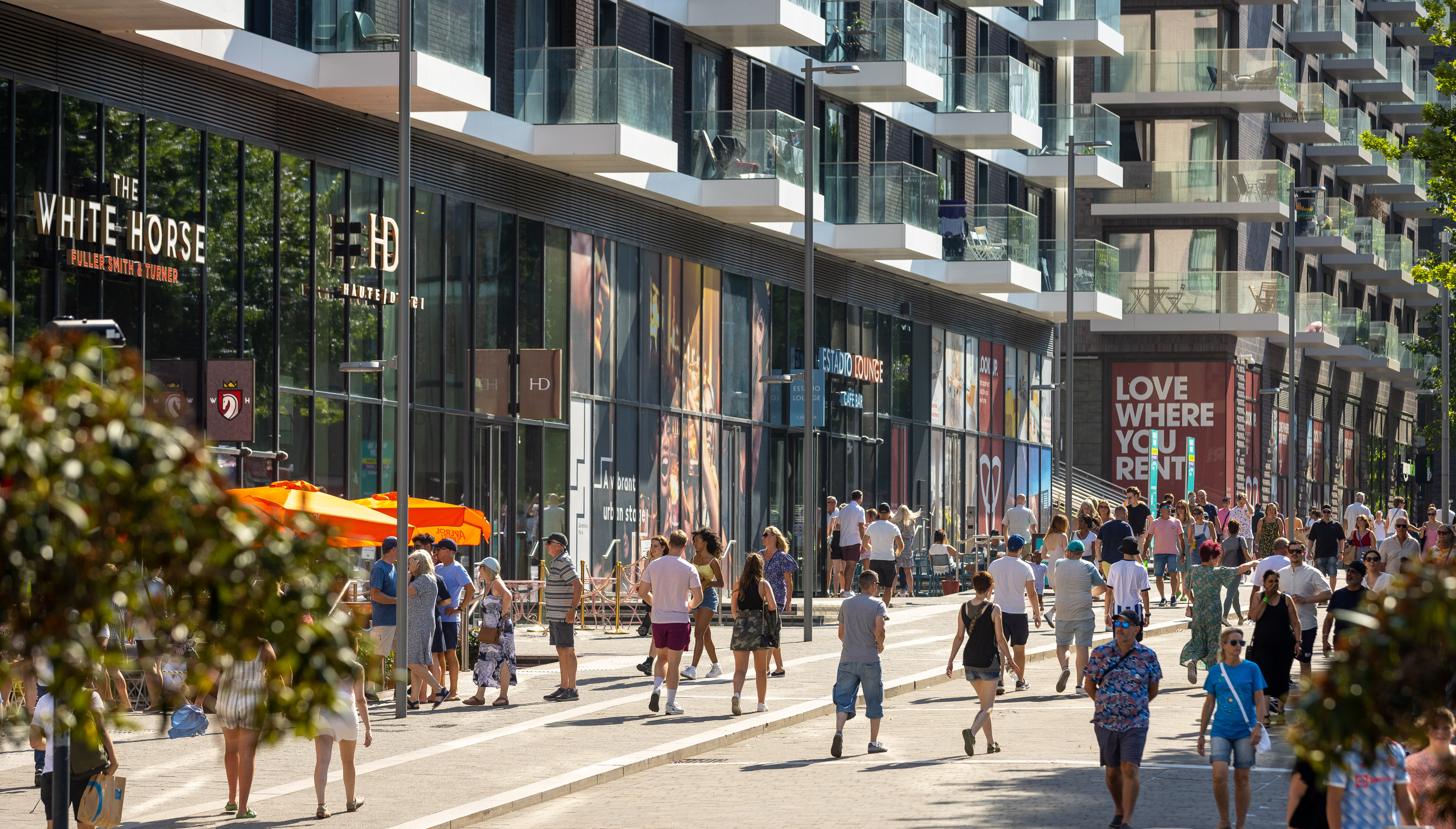 Image of people walking through Wembley 