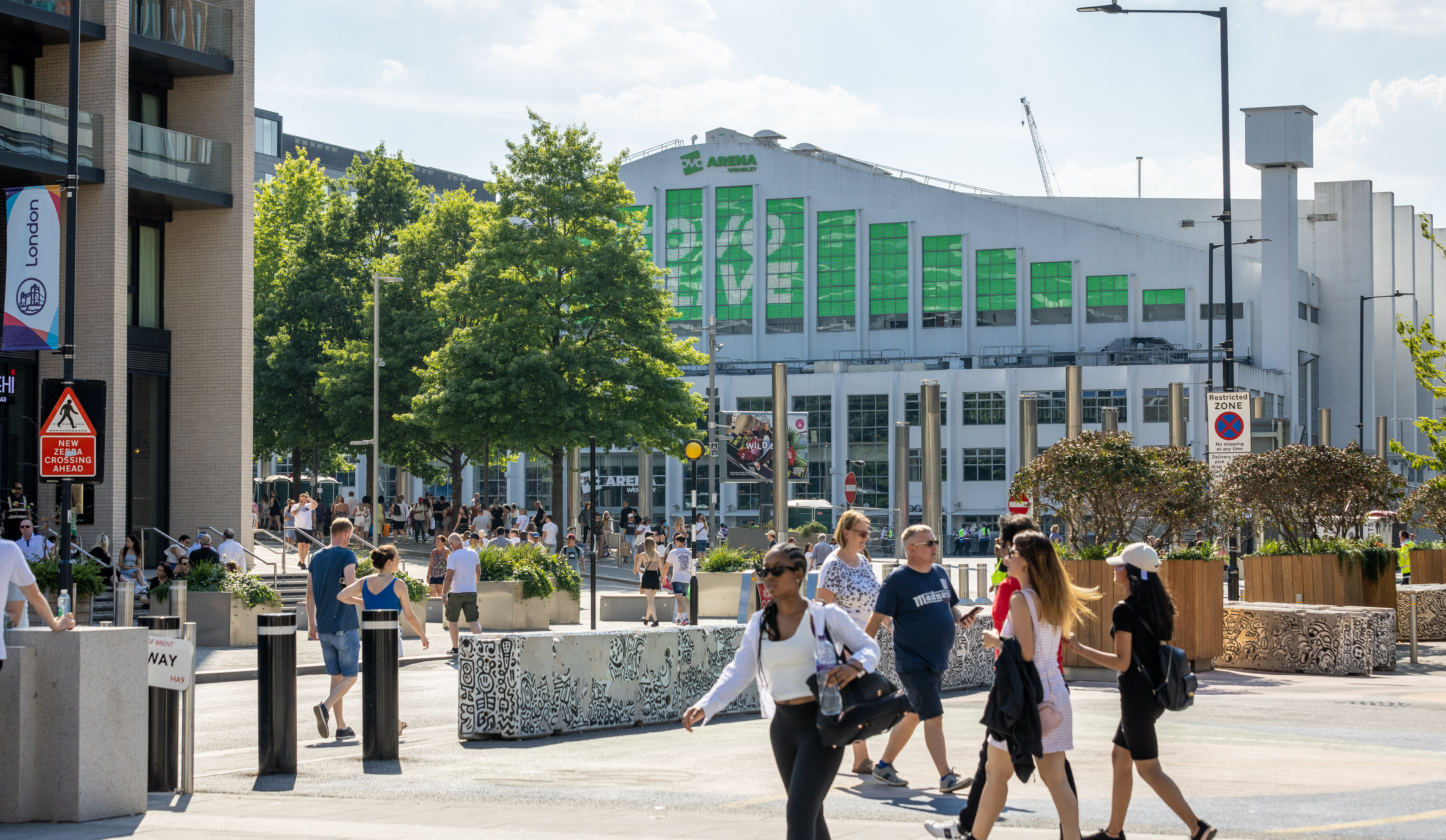 Image of people walking through Wembley 