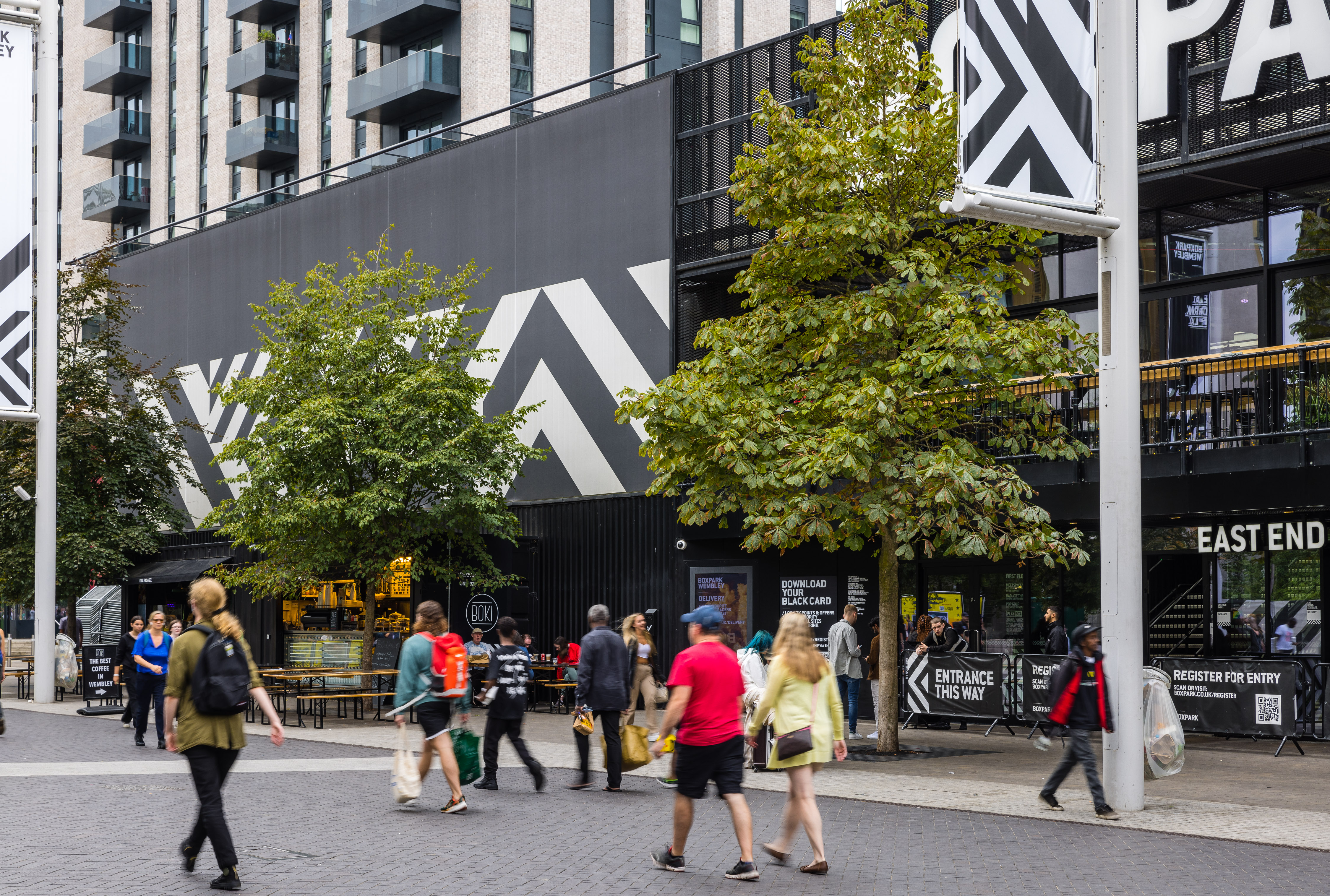 Image of people walking through Wembley 