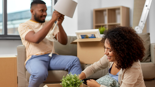 Couple taking items out of a box