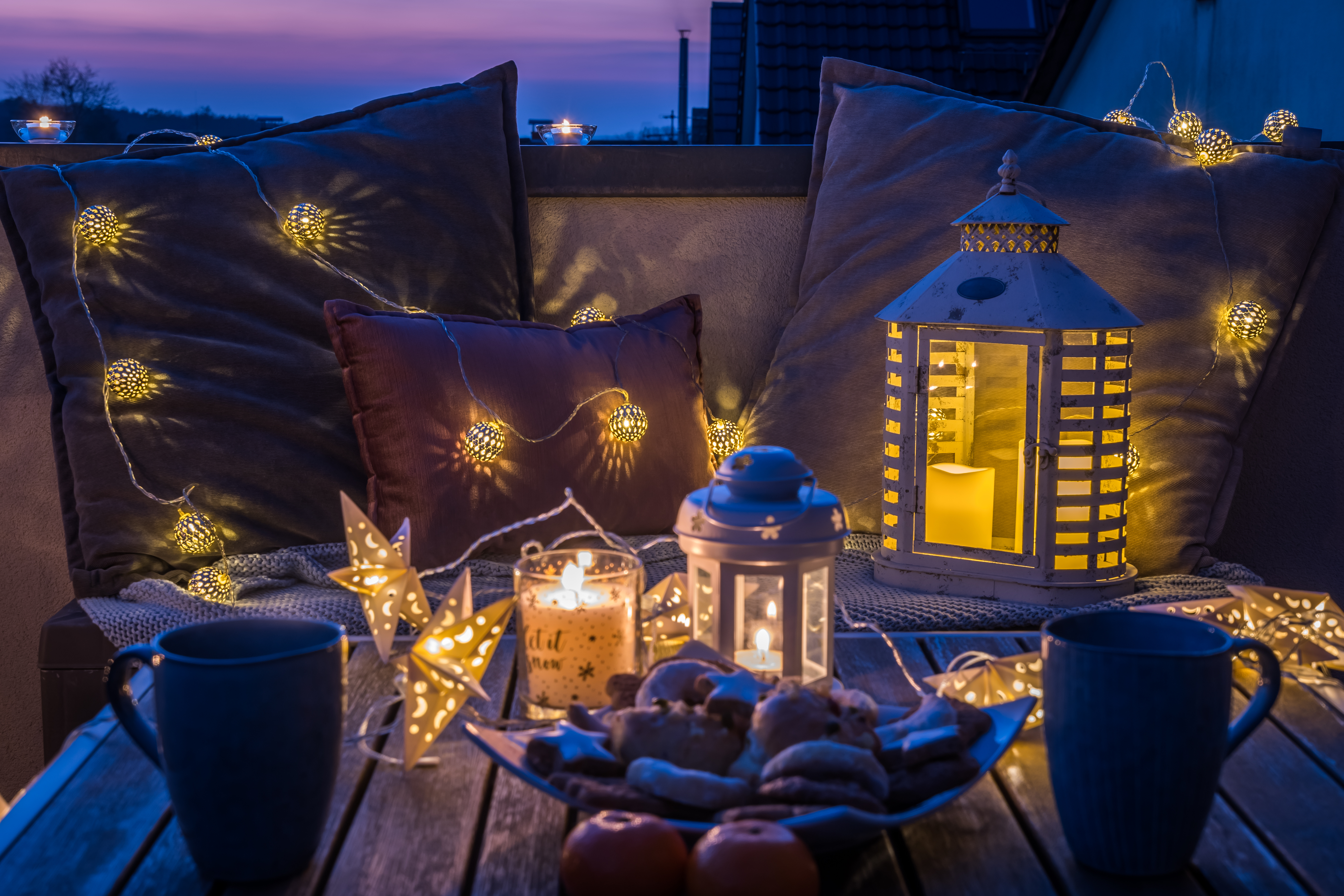Terrace at night with candles and fairylights 
