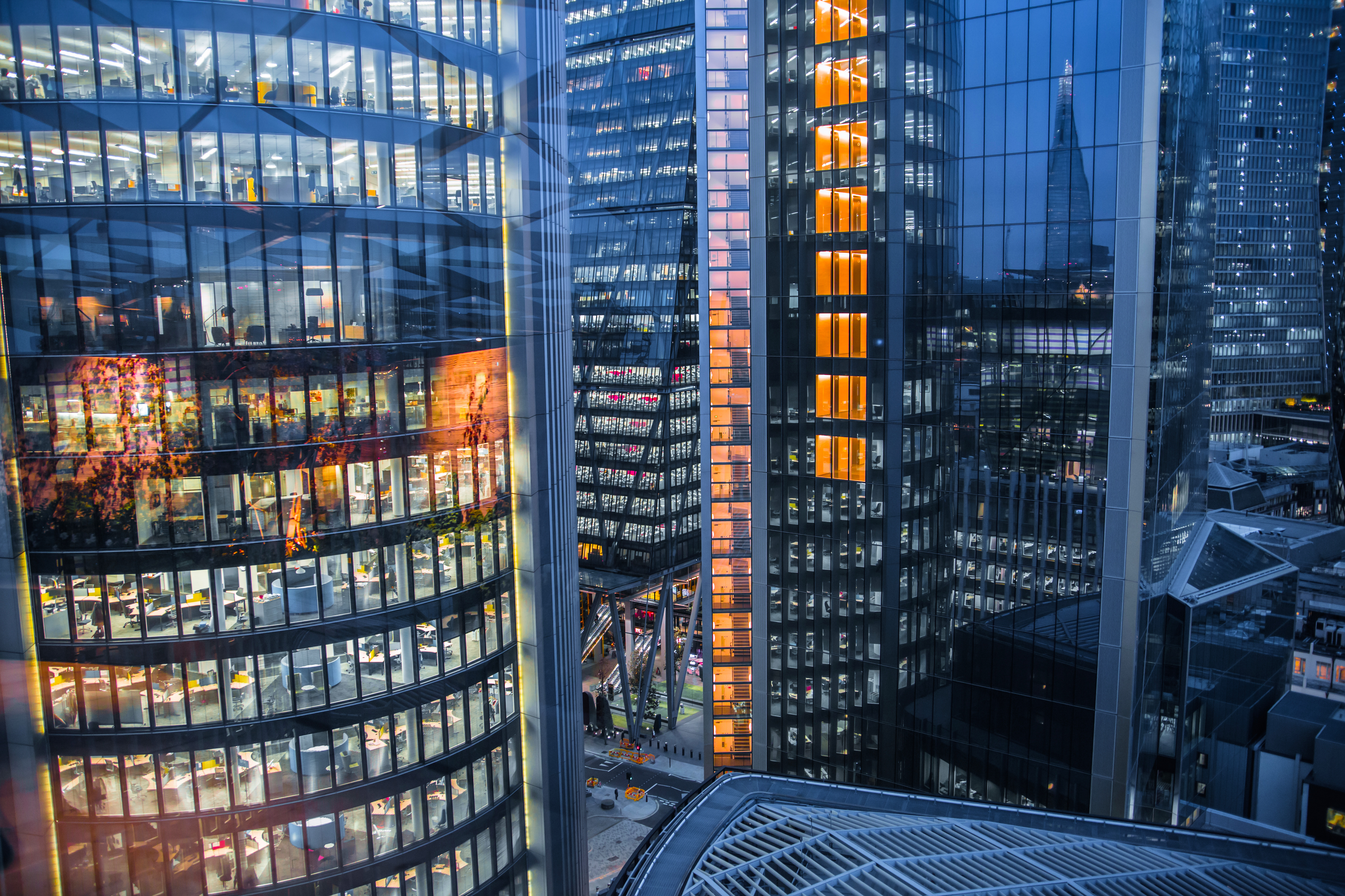 Night time view of offices in a city 