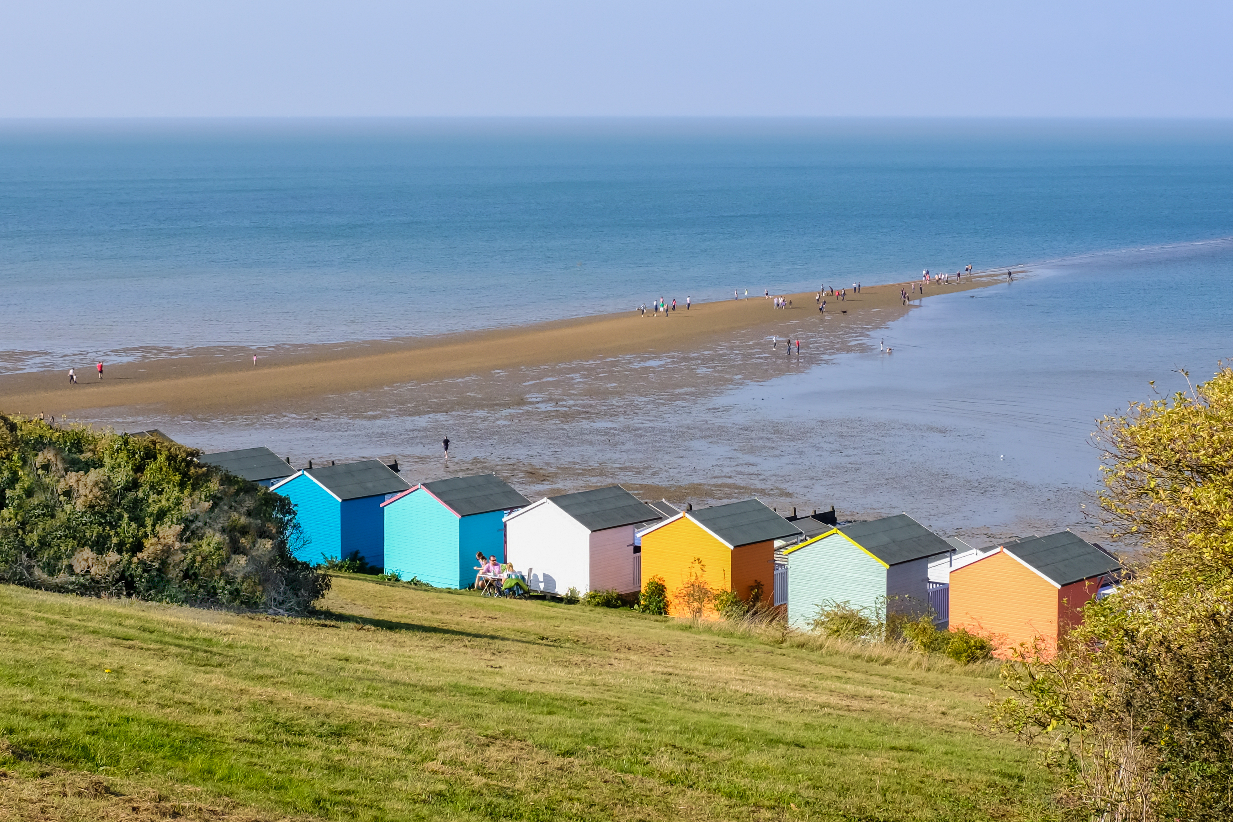 beach with colourful houses in kent