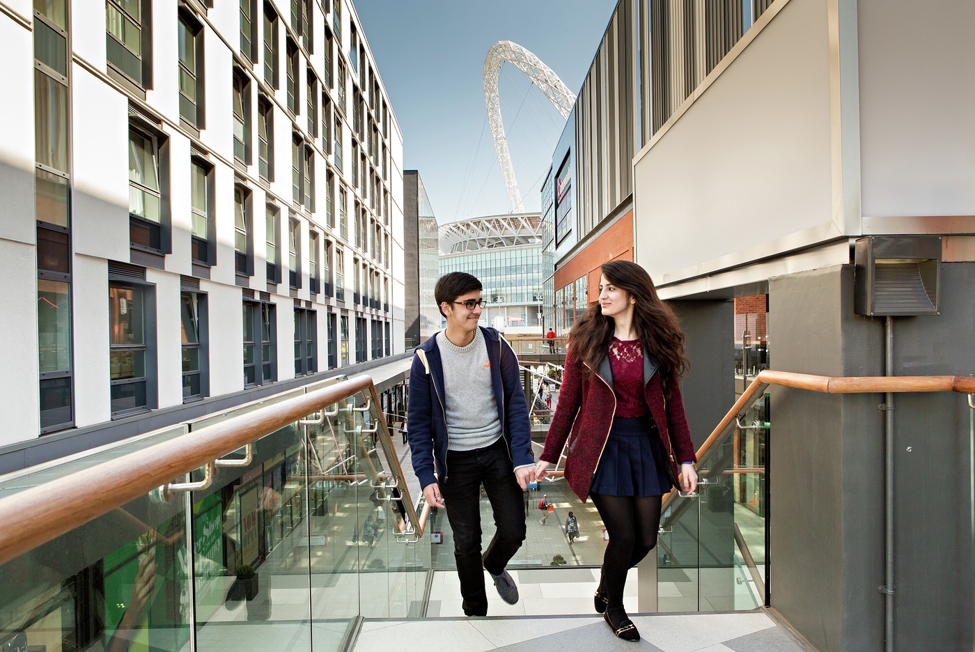 Couple walking through London Designer Outlet, Wembley Park