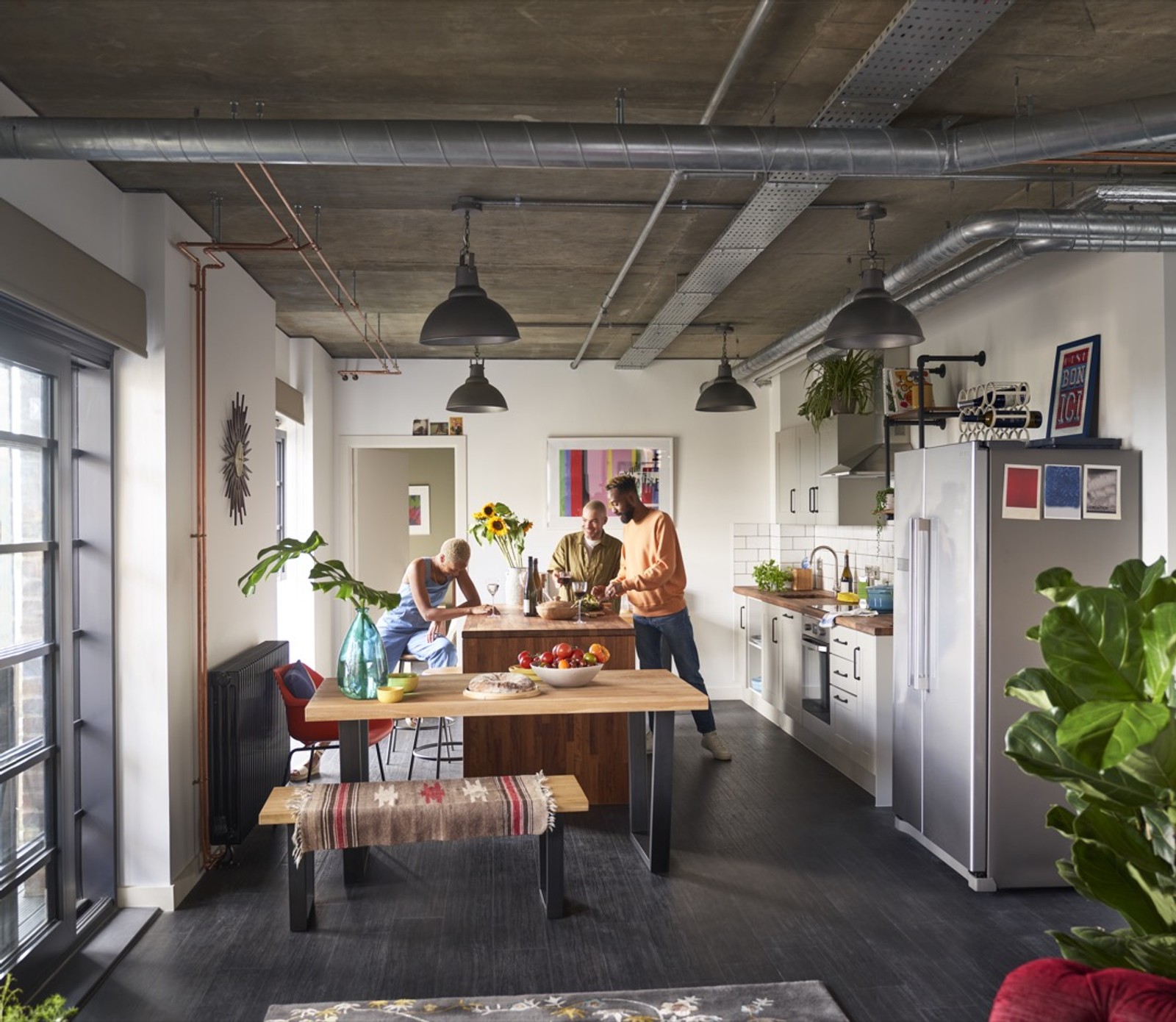 A group of people in the kitchen