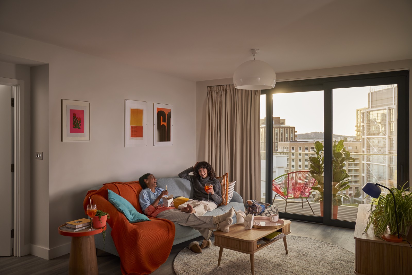 two people relaxing in their apartment