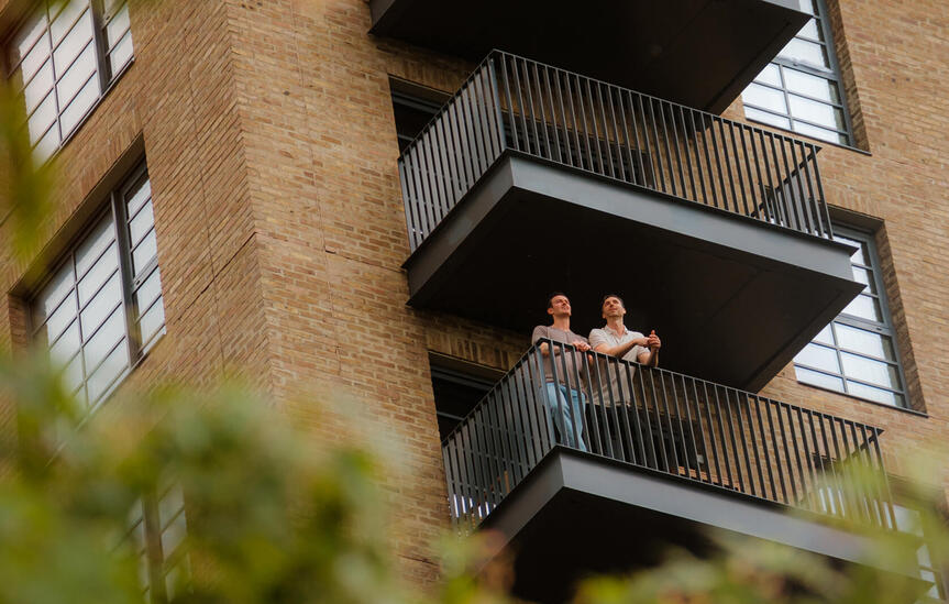 a couple on their balcony